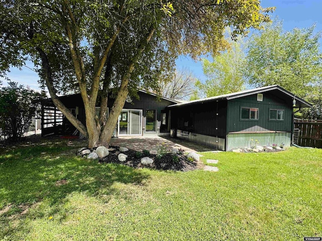 737 Cascade St, Lander, WY 82520 - back of house with a patio area