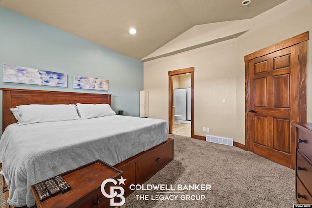 972 Cornwall St, Casper, WY 82609 - carpeted bedroom featuring vaulted ceiling, ensuite bathroom, and baseboards
