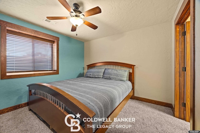 972 Cornwall St, Casper, WY 82609 - carpeted bedroom featuring baseboards, a textured ceiling, and ceiling fan