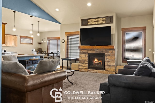 972 Cornwall St, Casper, WY 82609 - living area with a stone fireplace, vaulted ceiling, carpet flooring, and recessed lighting