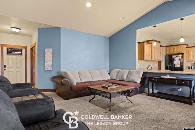 972 Cornwall St, Casper, WY 82609 - carpeted living area featuring lofted ceiling and baseboards