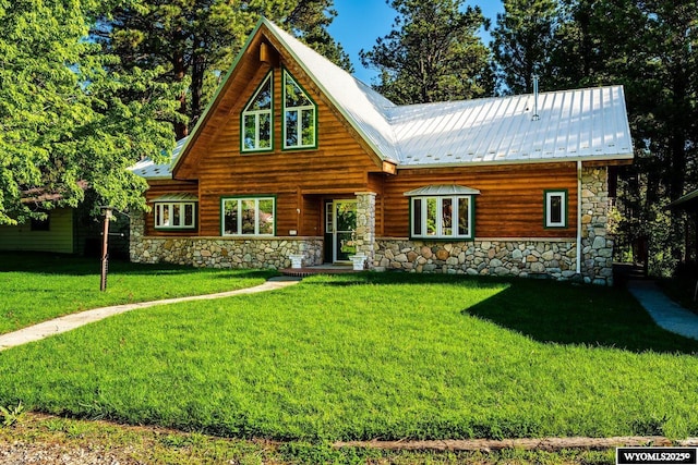43 Fish Hatchery Rd, Story, WY 82842 - cabin with stone siding, a front lawn, and metal roof