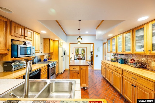 43 Fish Hatchery Rd, Story, WY 82842 - kitchen featuring stainless steel appliances, decorative backsplash, decorative light fixtures, a center island, and recessed lighting