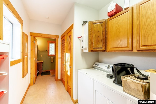 43 Fish Hatchery Rd, Story, WY 82842 - laundry area with cabinet space, independent washer and dryer, baseboards, and light floors