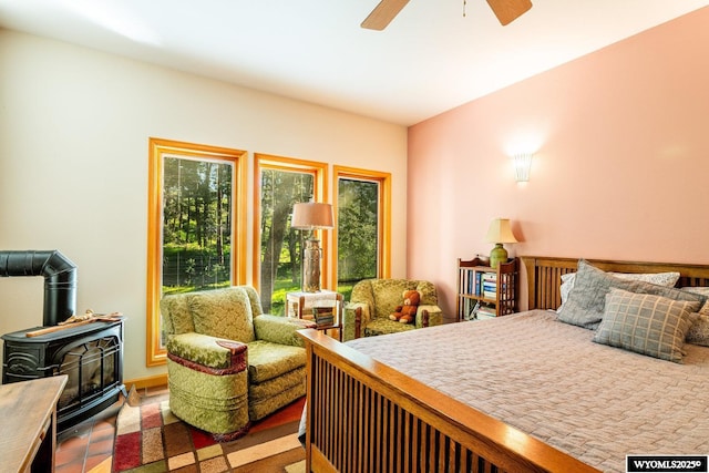 43 Fish Hatchery Rd, Story, WY 82842 - bedroom with a wood stove and ceiling fan