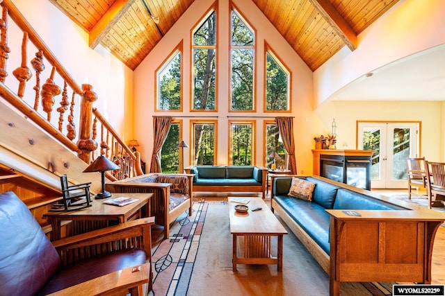 43 Fish Hatchery Rd, Story, WY 82842 - living area with high vaulted ceiling, wooden ceiling with exposed beams, healthy amount of natural light, french doors, and stairway