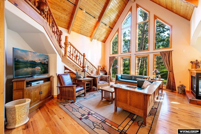 43 Fish Hatchery Rd, Story, WY 82842 - living room with wooden ceiling with exposed beams, stairs, light wood-style flooring, high vaulted ceiling, and plenty of natural light