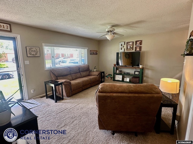 3024 Hamilton Way, Casper, WY 82609 - living room with carpet floors, ceiling fan, and a textured ceiling