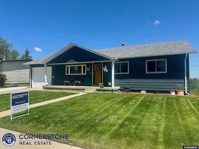 3024 Hamilton Way, Casper, WY 82609 - single story home with an attached garage, a front lawn, and a shingled roof