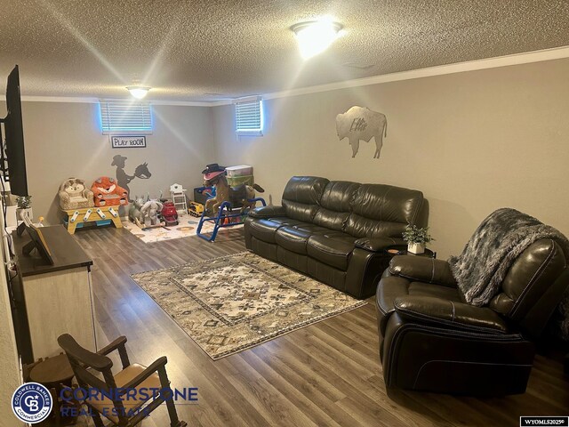 3024 Hamilton Way, Casper, WY 82609 - living area with ornamental molding, a textured ceiling, and wood finished floors
