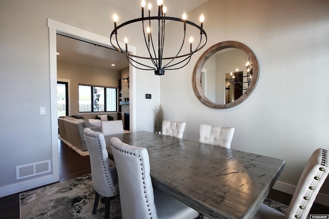 3685 Timber Wolf Ct, Casper, WY 82604 - dining space featuring a chandelier, radiator, baseboards, wood finished floors, and recessed lighting