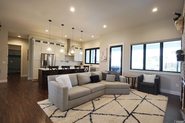 3685 Timber Wolf Ct, Casper, WY 82604 - living area featuring dark wood-type flooring, recessed lighting, and baseboards