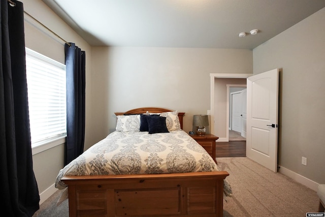 3685 Timber Wolf Ct, Casper, WY 82604 - carpeted bedroom featuring multiple windows and baseboards