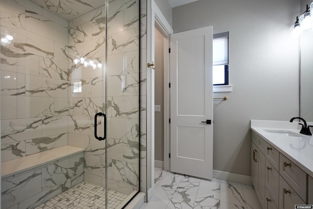 3685 Timber Wolf Ct, Casper, WY 82604 - full bath with marble look tile flooring, a marble finish shower, vanity, and baseboards