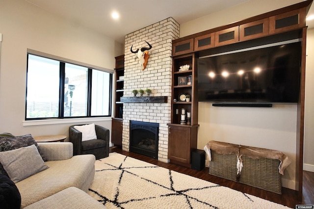 3685 Timber Wolf Ct, Casper, WY 82604 - living room featuring wood finished floors, a fireplace, and baseboards