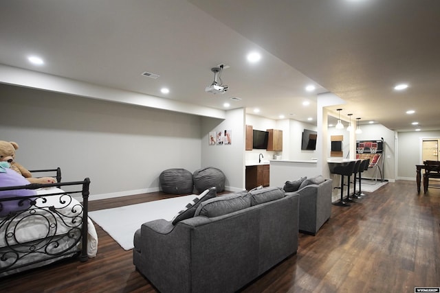 3685 Timber Wolf Ct, Casper, WY 82604 - living room with baseboards, dark wood finished floors, and recessed lighting