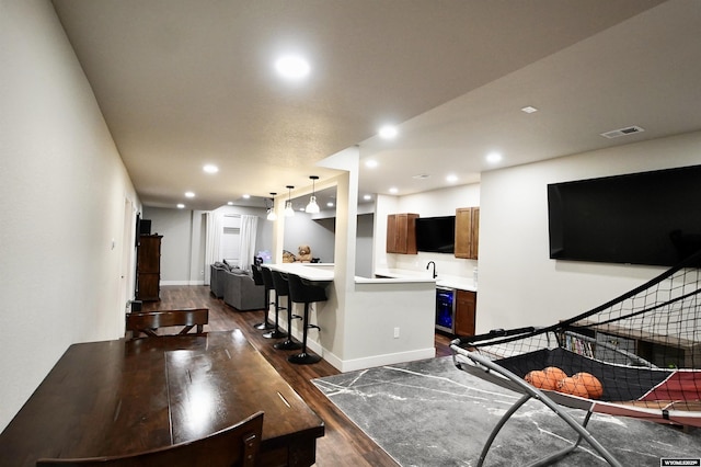3685 Timber Wolf Ct, Casper, WY 82604 - living area featuring dark wood-style flooring, recessed lighting, and baseboards