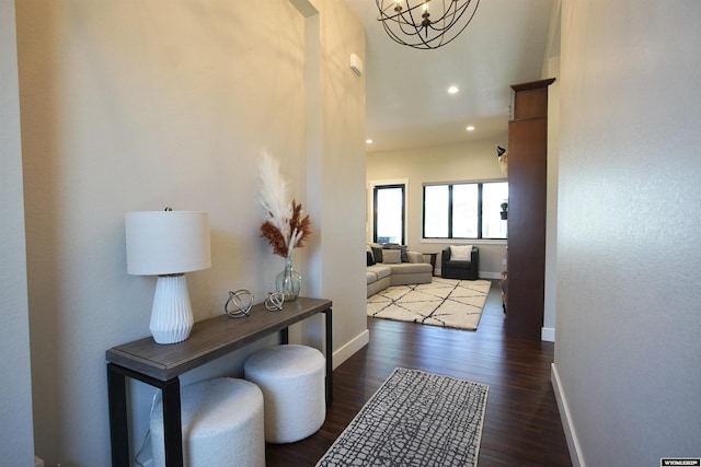 3685 Timber Wolf Ct, Casper, WY 82604 - hall with baseboards, dark wood-style flooring, a chandelier, and recessed lighting