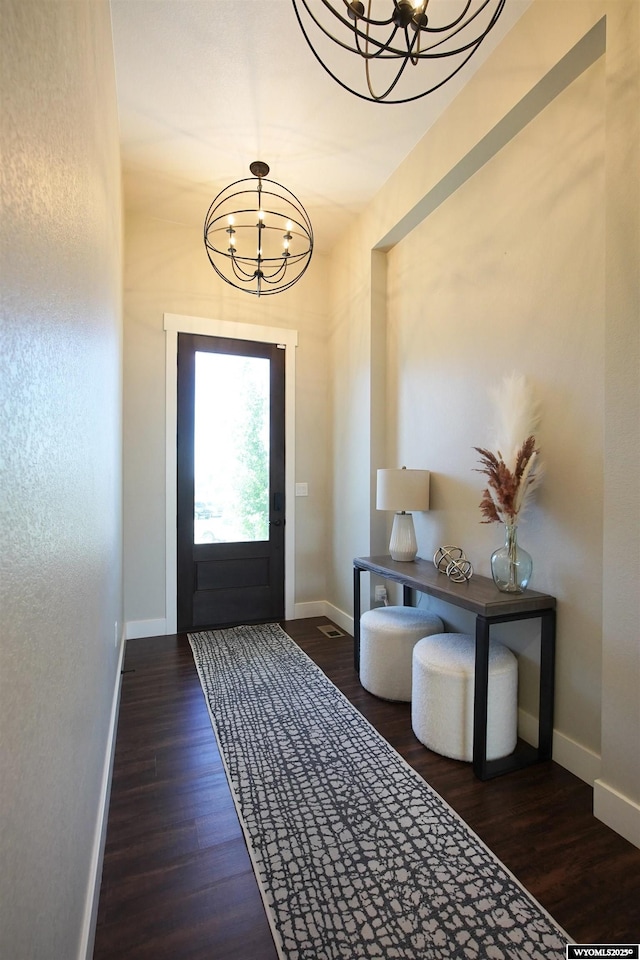 3685 Timber Wolf Ct, Casper, WY 82604 - foyer featuring a chandelier, wood finished floors, and baseboards