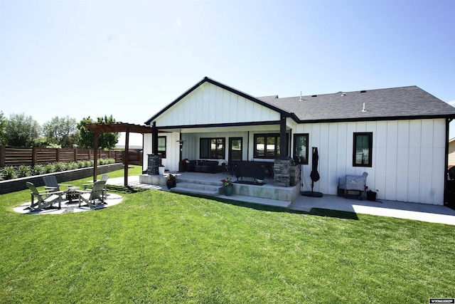 3685 Timber Wolf Ct, Casper, WY 82604 - rear view of house with a fire pit, board and batten siding, a patio area, and roof with shingles
