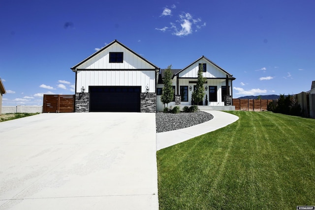 3685 Timber Wolf Ct, Casper, WY 82604 - modern farmhouse style home featuring a garage, board and batten siding, and stone siding