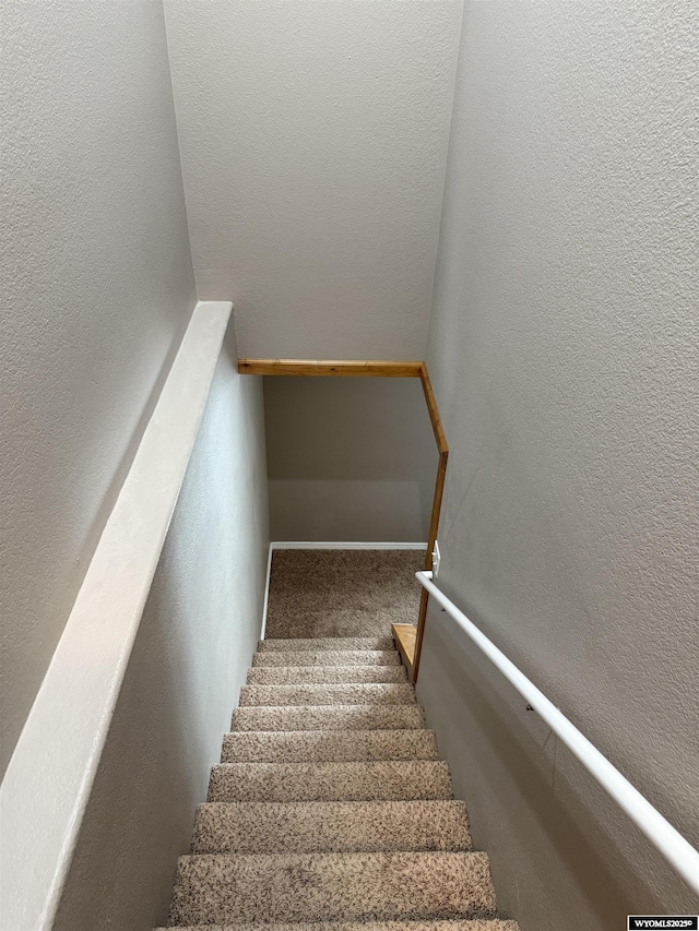 1765 New Mexico St, Green River, WY 82935 - stairway featuring carpet flooring and a textured wall