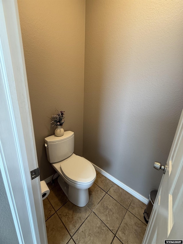 1765 New Mexico St, Green River, WY 82935 - bathroom with toilet, tile patterned floors, and baseboards