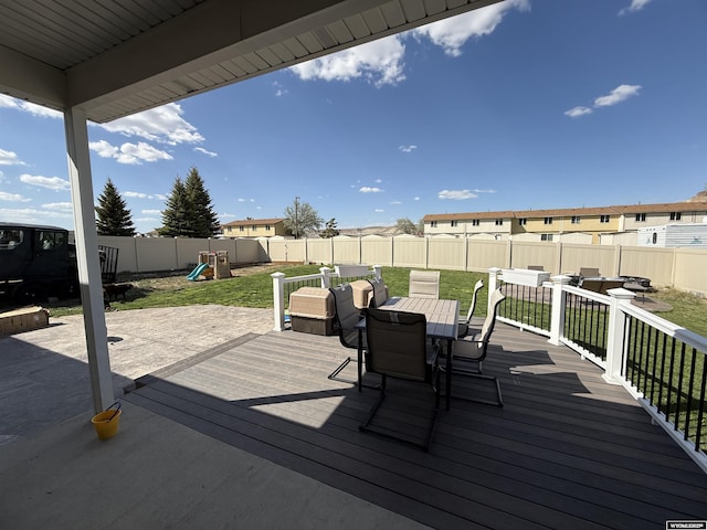 1765 New Mexico St, Green River, WY 82935 - wooden deck with outdoor dining space and a playground