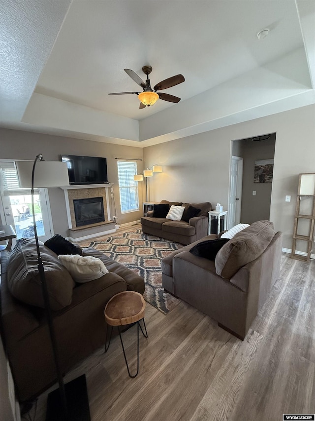 1765 New Mexico St, Green River, WY 82935 - living area with a raised ceiling, wood finished floors, ceiling fan, and baseboards