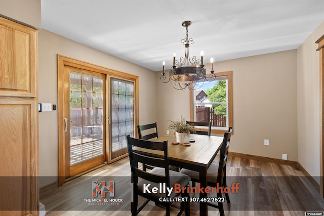 5411 S Oak St, Casper, WY 82601 - dining space with healthy amount of natural light, a chandelier, and wood finished floors