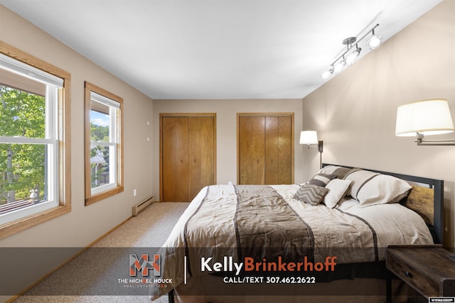 5411 S Oak St, Casper, WY 82601 - carpeted bedroom with multiple closets, multiple windows, and baseboard heating