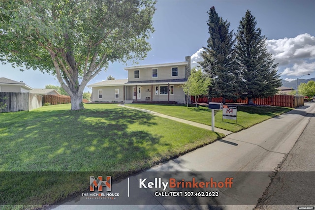 5411 S Oak St, Casper, WY 82601 - view of front of house with a chimney and covered porch