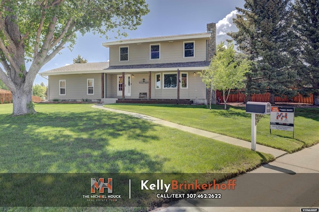 5411 S Oak St, Casper, WY 82601 - view of front of home with a chimney, covered porch, and roof with shingles