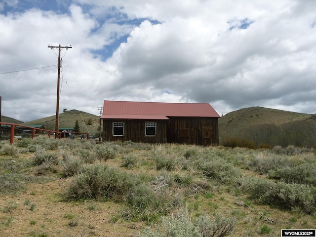 20 N Granier Ave, Atlantic City, WY 82520 - view of side of home featuring a mountain view and metal roof