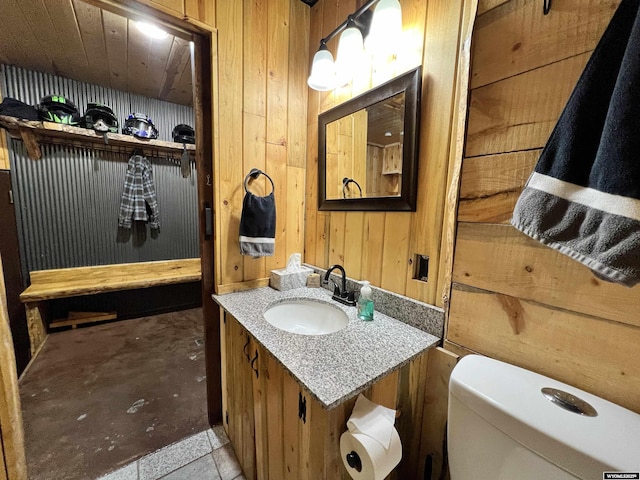 10096 S Cantrell Rd, Casper, WY 82601 - half bath with wood walls, vanity, and toilet
