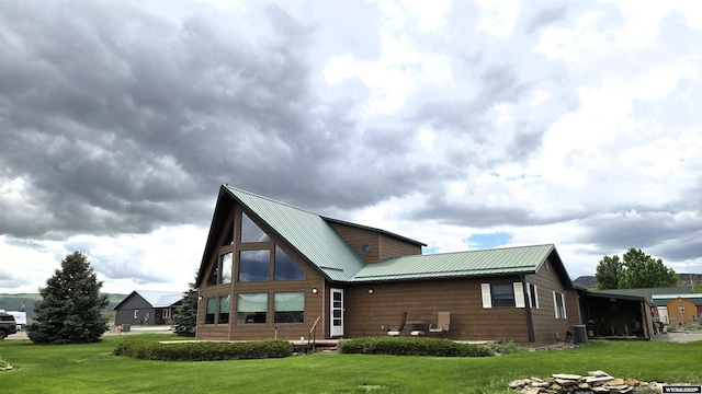 190 Ln 7, Thermopolis, WY 82443 - rear view of property featuring a lawn and metal roof