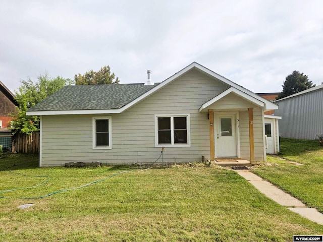 311 3rd St, Ten Sleep, WY 82442 - view of front of home featuring a front yard and roof with shingles