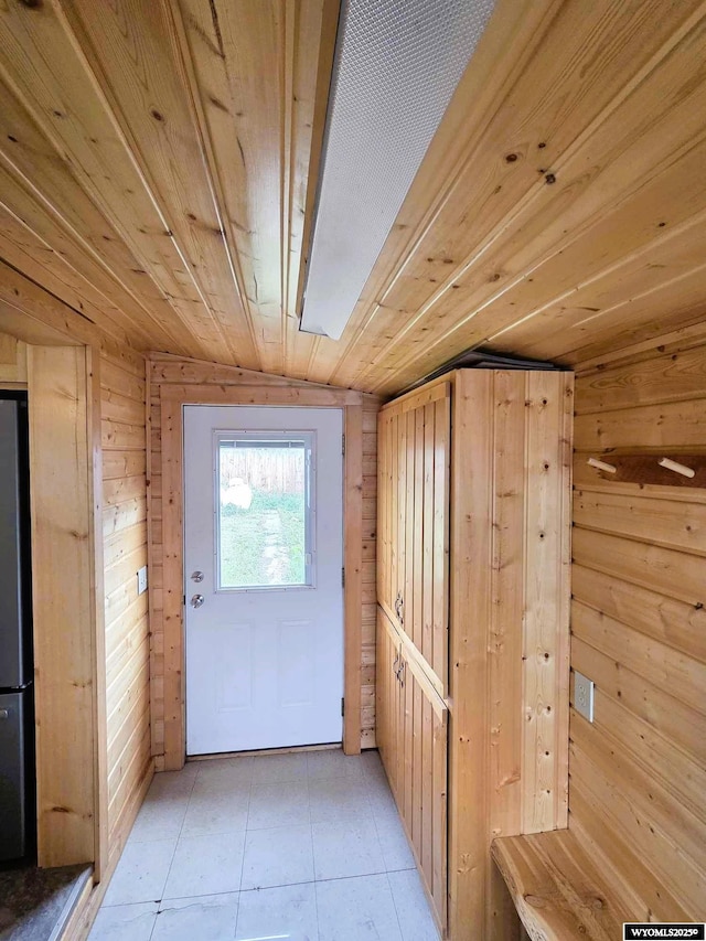 311 3rd St, Ten Sleep, WY 82442 - entryway with wooden walls and light tile patterned floors