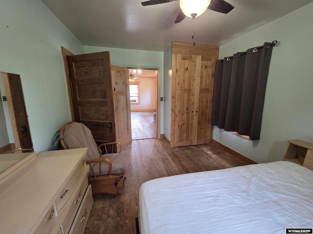 311 3rd St, Ten Sleep, WY 82442 - bedroom featuring dark wood-style floors and a ceiling fan