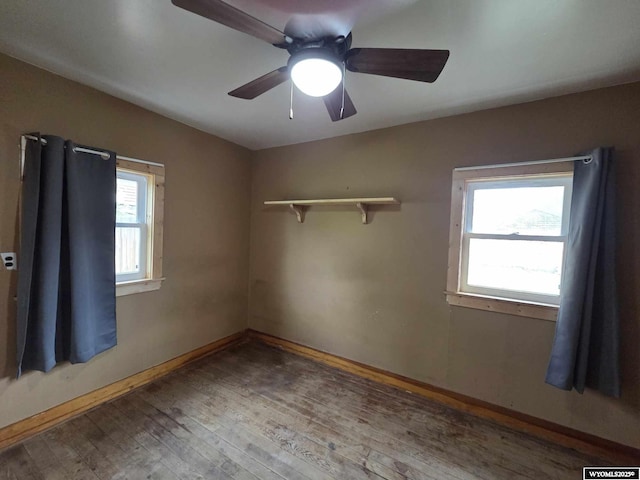 311 3rd St, Ten Sleep, WY 82442 - unfurnished room featuring wood-type flooring, baseboards, and a ceiling fan