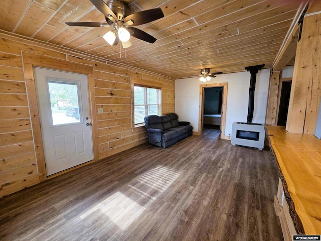 311 3rd St, Ten Sleep, WY 82442 - unfurnished living room with a wood stove, wooden ceiling, a ceiling fan, and healthy amount of natural light