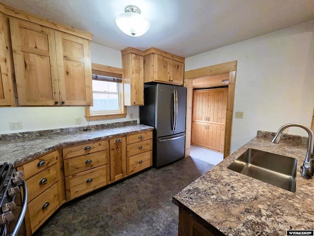 311 3rd St, Ten Sleep, WY 82442 - kitchen featuring freestanding refrigerator, a sink, and gas range