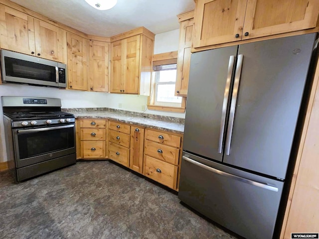 311 3rd St, Ten Sleep, WY 82442 - kitchen featuring appliances with stainless steel finishes and light brown cabinets