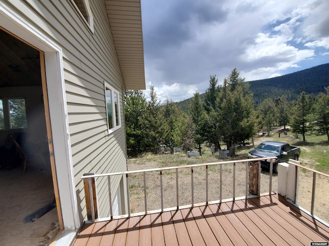 8 Lookout Ln, Dubois, WY 82513 - deck featuring a forest view, a mountain view, and grilling area