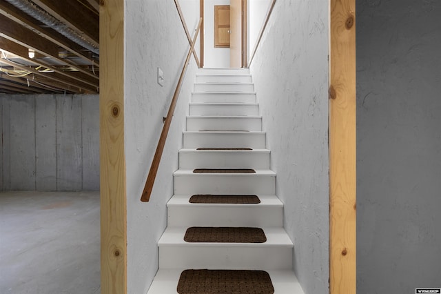 1673 Troy, Kemmerer, WY 83101 - stairs featuring concrete floors and a textured wall