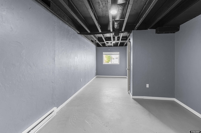 1673 Troy, Kemmerer, WY 83101 - below grade area with a baseboard heating unit and baseboards
