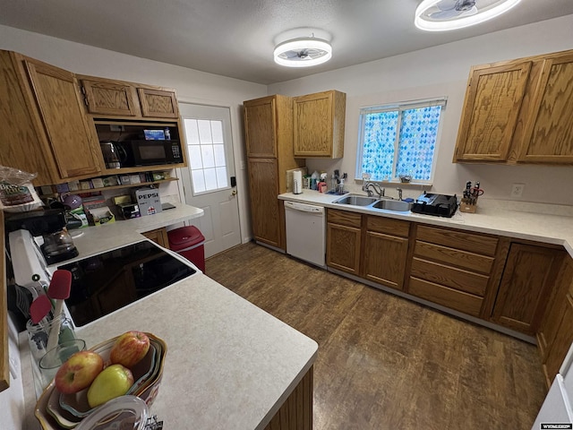 321 N 2nd St, Riverton, WY 82501 - kitchen with dishwasher, a sink, black microwave, and brown cabinets