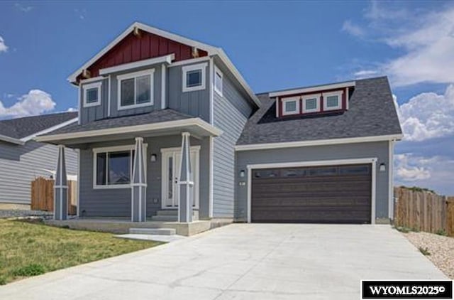 827 Dusty Ter, Mills, WY 82604 - craftsman-style home featuring board and batten siding, driveway, and an attached garage