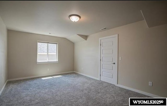 827 Dusty Ter, Mills, WY 82604 - bonus room with carpet flooring, baseboards, and vaulted ceiling