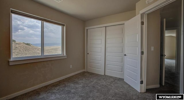 827 Dusty Ter, Mills, WY 82604 - unfurnished bedroom with carpet flooring, baseboards, and a closet